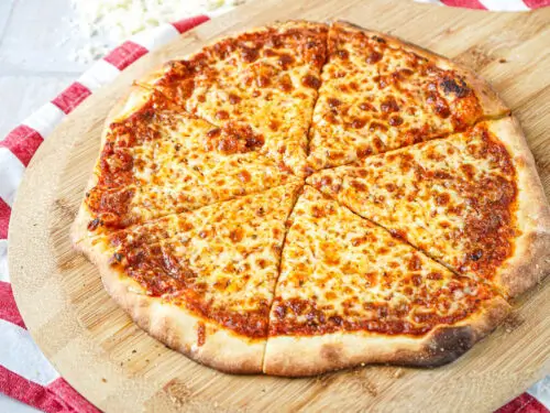 Classic American-style pizza on a wooden table